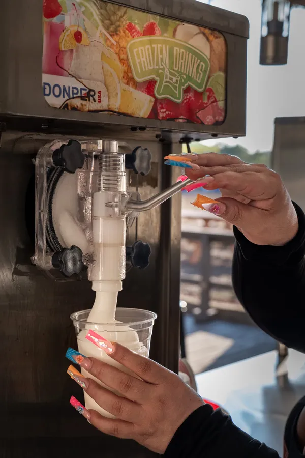 A frozen drink being poured at the Paradise Live bar