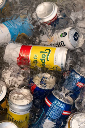 A cooler packed with ice and canned drinks at the Paradise Live car show