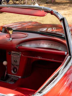 The red leather interior of a vintage Corvette convertible